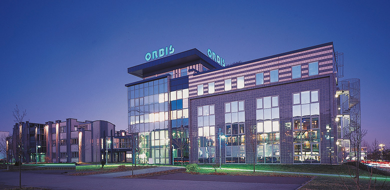 Exterior view of ORBIS AG in the evening